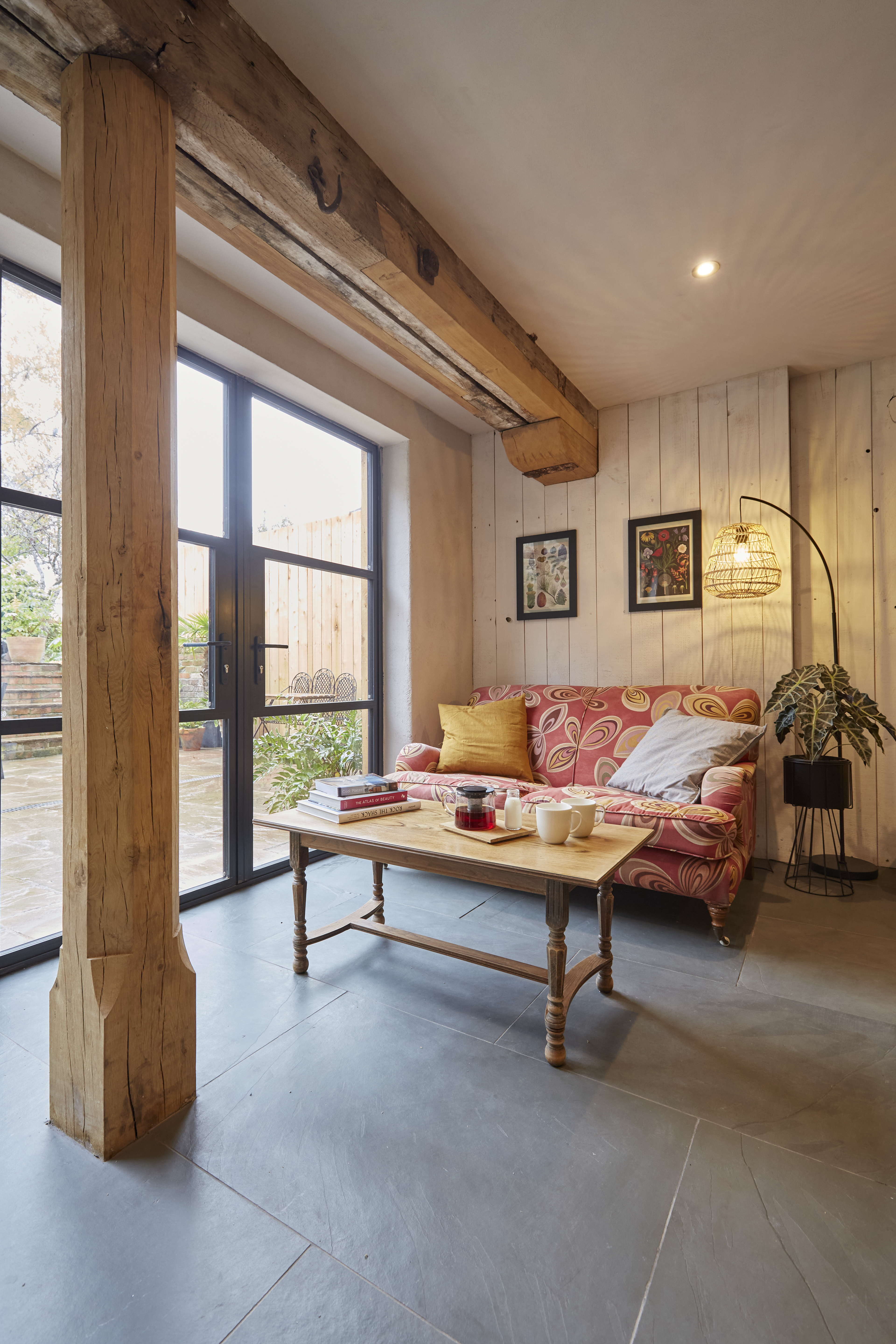 A view across the slate floor with timber post in the back room